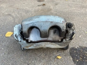 Суппорт тормозной Mitsubishi Outlander 3 GF 2012-2023 Перед. Лев.