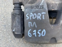 Суппорт тормозной Kia Sportage QL 2015-2022 Перед. Лев.