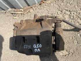 Суппорт тормозной Infiniti Q50 V37 2013- Перед. Лев.