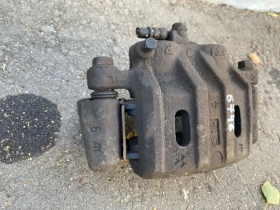 Суппорт тормозной Mitsubishi Outlander 3 GF 2012-2023 Перед. Прав.