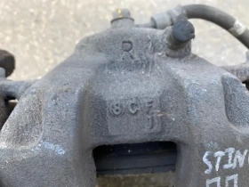 Суппорт тормозной Kia Stinger J5 2017- Перед. 