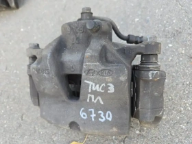 Суппорт тормозной Hyundai Tucson TL 2015-2021 Перед. Лев.