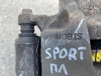 Суппорт тормозной Kia Sportage QL 2015-2022 Перед. Лев.