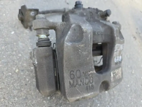 Суппорт тормозной Kia Stinger J5 2017- Перед. Прав.