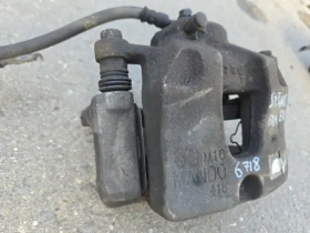 Суппорт тормозной Kia Stinger J5 2017- Перед. Лев.