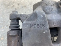 Суппорт тормозной Kia Sportage QL 2015-2022 Перед. Лев.