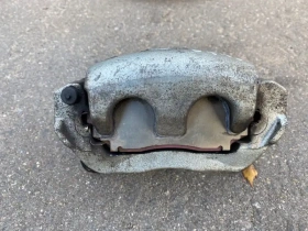 Суппорт тормозной Mitsubishi Outlander 3 GF 2012-2023 Перед. Лев.