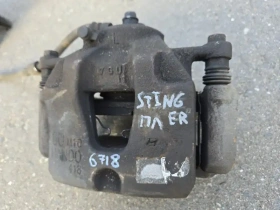 Суппорт тормозной Kia Stinger J5 2017- Перед. Лев.