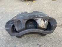 Суппорт тормозной Kia Sportage QL 2015-2022 Перед. Лев.