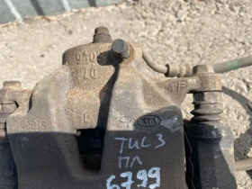 Суппорт тормозной Hyundai Tucson TL 2015-2021 Перед. Лев.