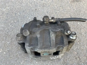 Суппорт тормозной Mitsubishi Outlander 3 GF 2012-2023 Перед. Лев.