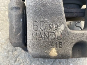 Суппорт тормозной Kia Stinger J5 2017- Перед. Прав.